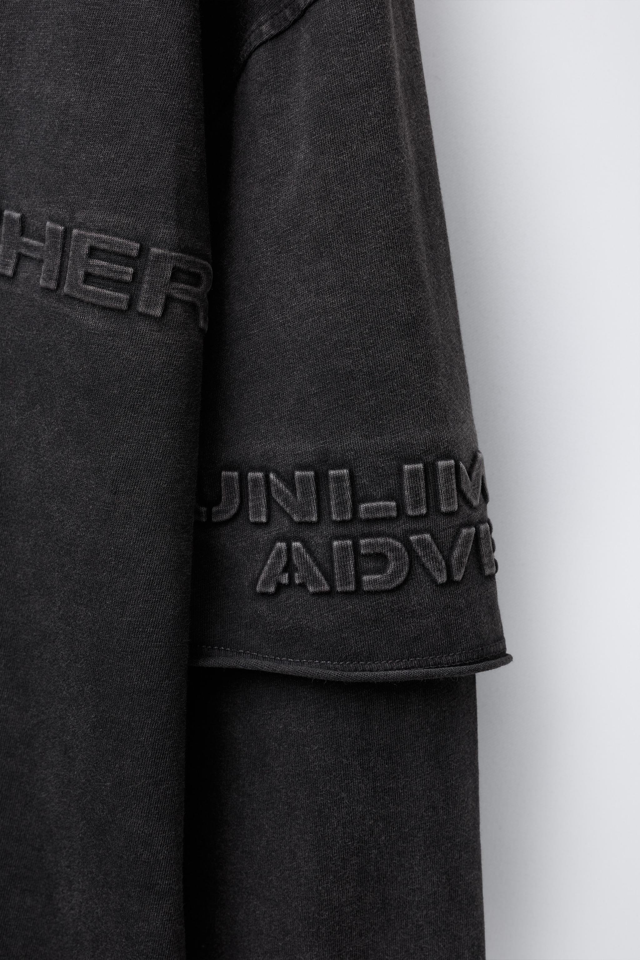 WASHED EFFECT DOUBLE SLEEVE RAISED TEXT T-SHIRT